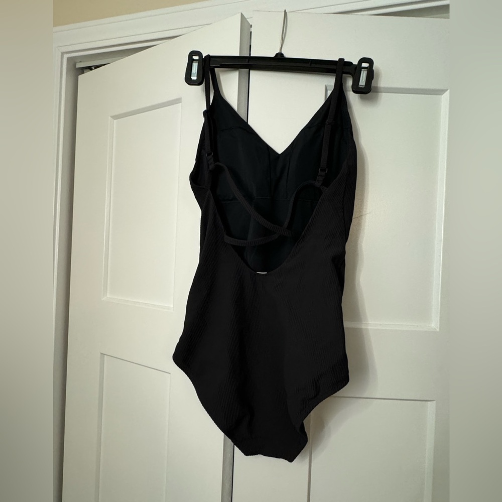 Lululemon one piece swim suit. Black size 6. Never worn